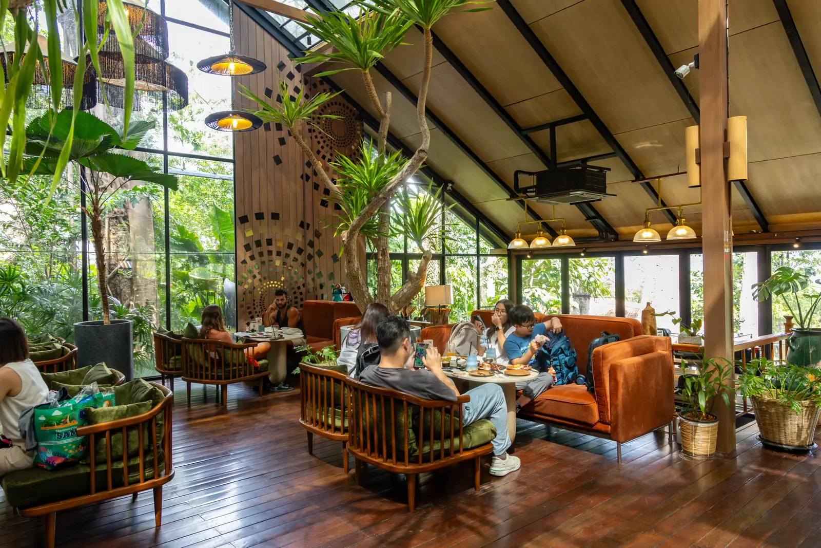 Allow time to enjoy your breakfast in Baboon's light-filled dining room. Guests seated among plants beneath Baboon's tall cafe windows