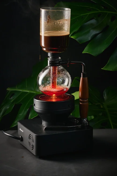 Coffee brewing in glass siphon equipment