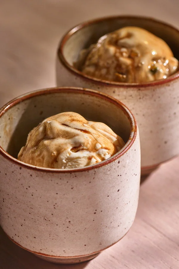 Close-up of ice cream with espresso in a pink ceramic cup