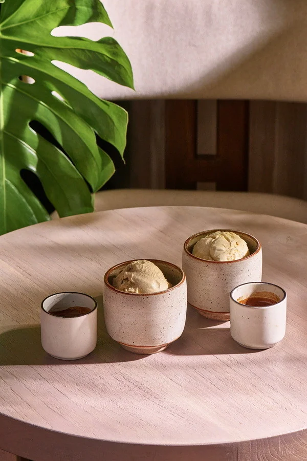 Ice cream cups and small espresso cups arranged together